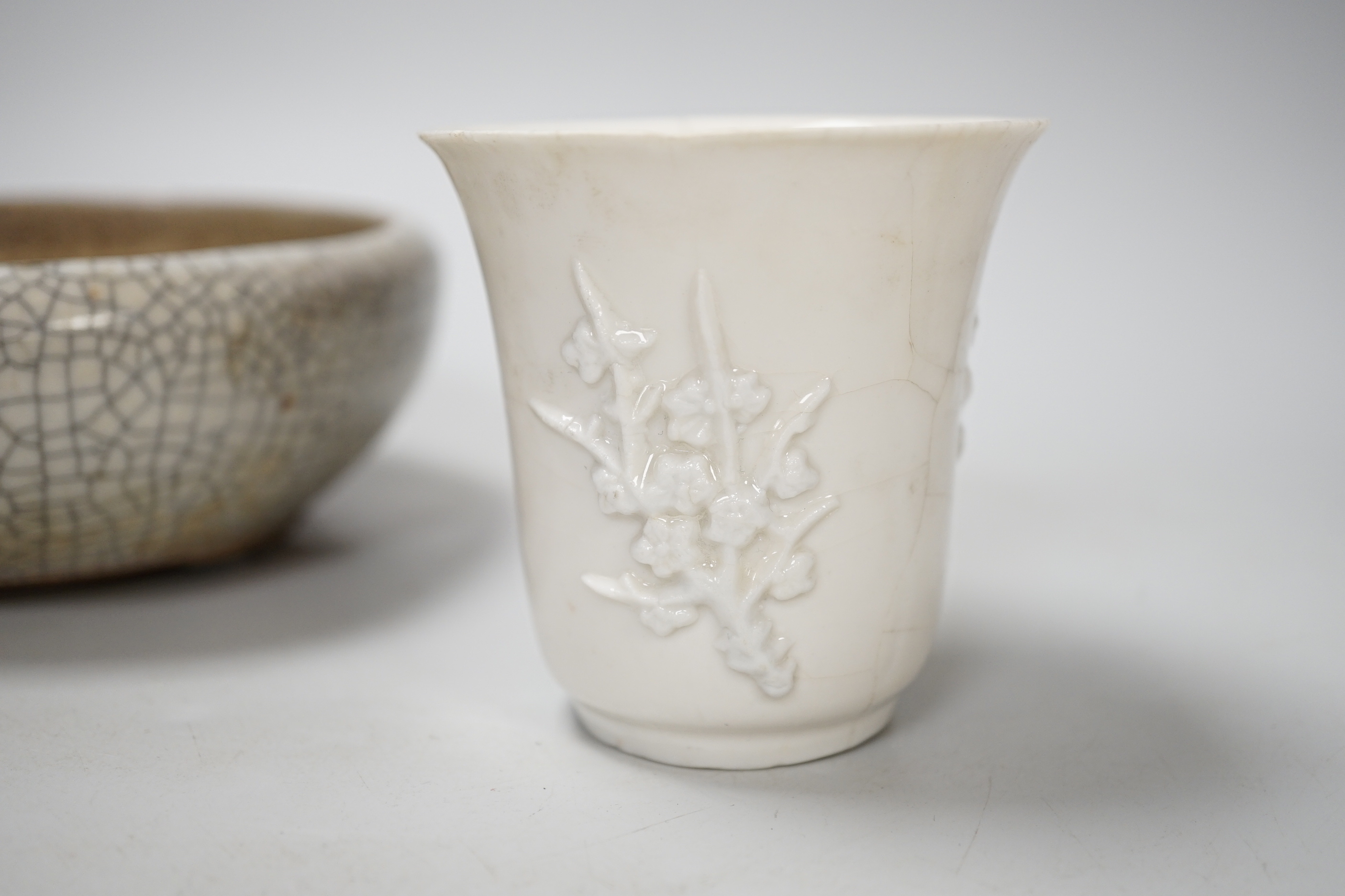 A Chinese crackleware bowl and a blanc de chine cup, bowl 14.5cm diameter